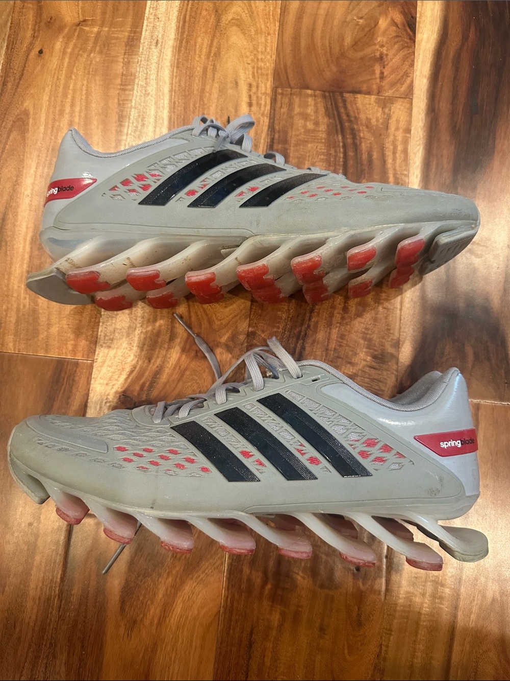 adidas Men's Light Gray Athletic Shoes with Black Stripes and Red Accents
